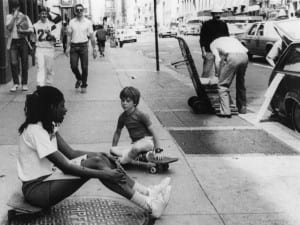 Rudy Burckhardt, Untitled (girl and young boy seated on skateboard), c.1985