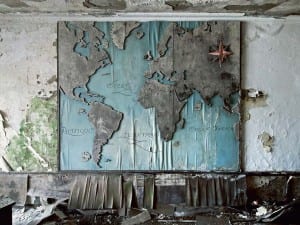 Reginald Van de Velde, World Tours, Not Wars, 2010. Belgium. A wooden world map is slowly rotting away inside the director’s office of a closed down factory.